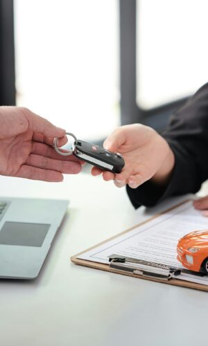 Employees sell keys to customers after agreeing to buy and sell cars. Approve auto loan contracts to