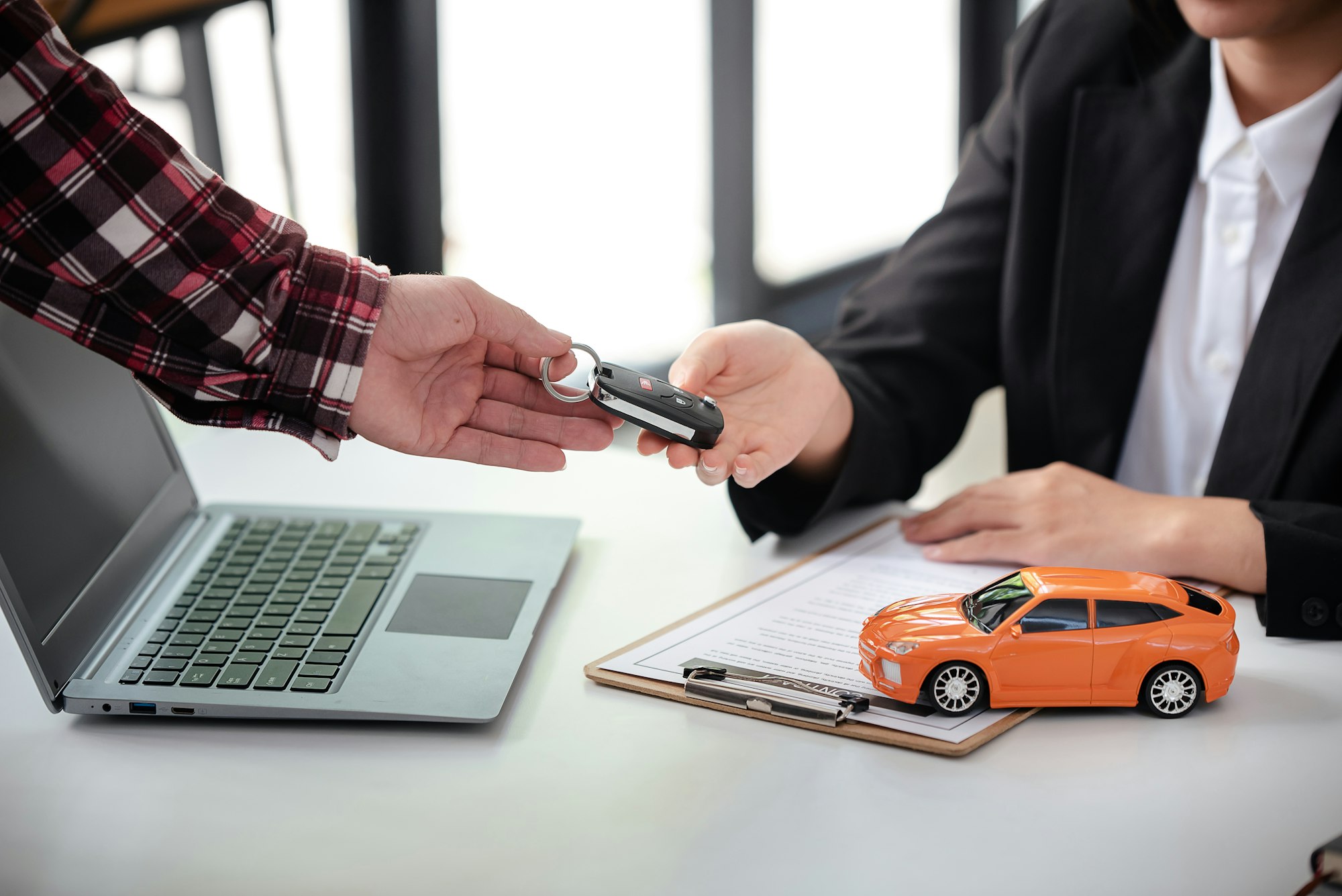 Employees sell keys to customers after agreeing to buy and sell cars. Approve auto loan contracts to